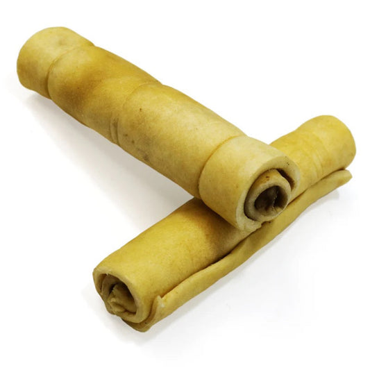 Two rolled-up dog treats on a white background