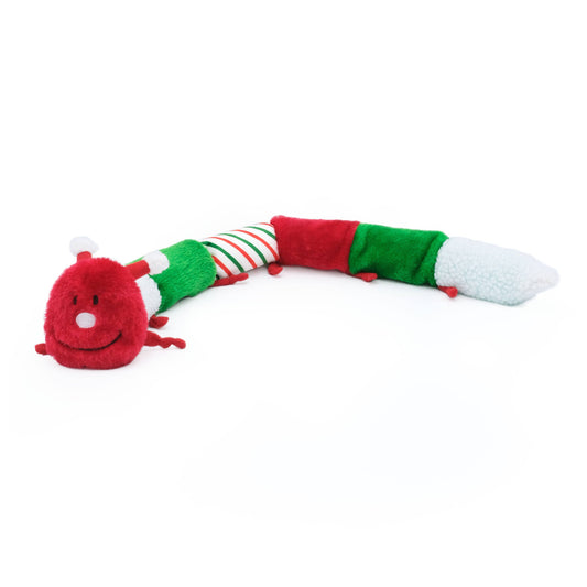 Plush toy resembling a snake with red, green, and white colors on a white background