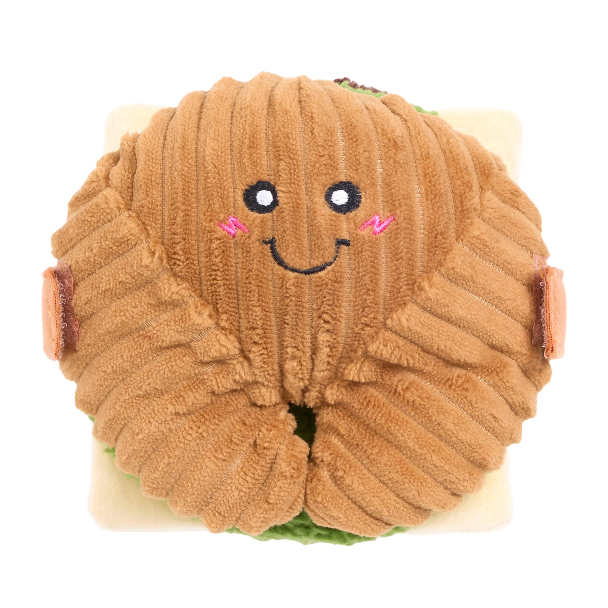 Plush toy resembling a brown bread roll with a smiling face on a white background